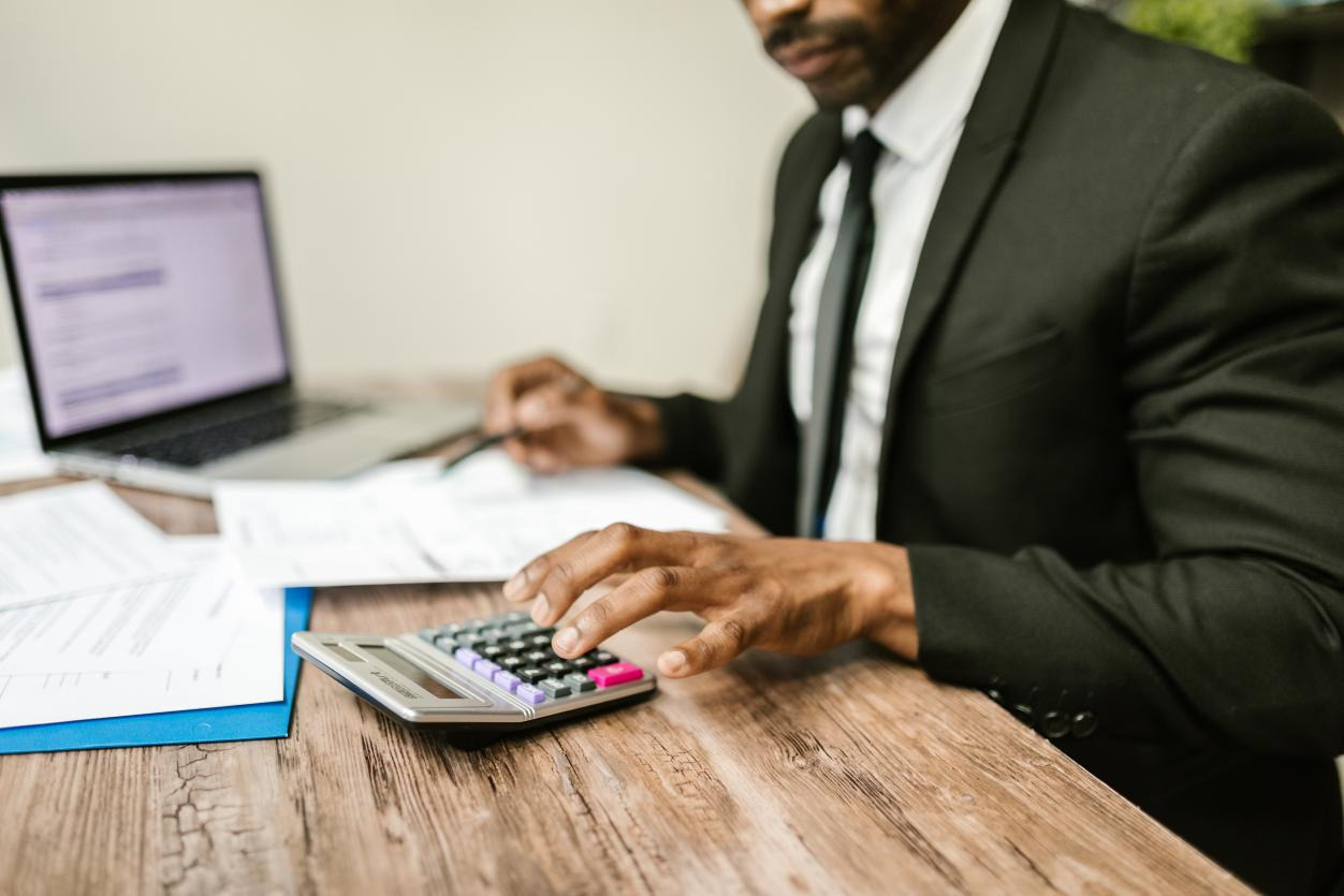 A man working with a calculator