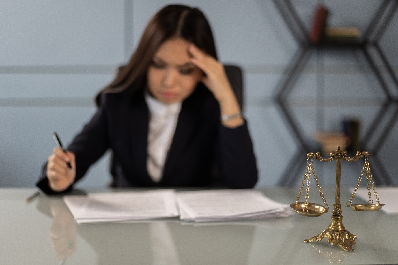 A family court lawyer reading at her desk