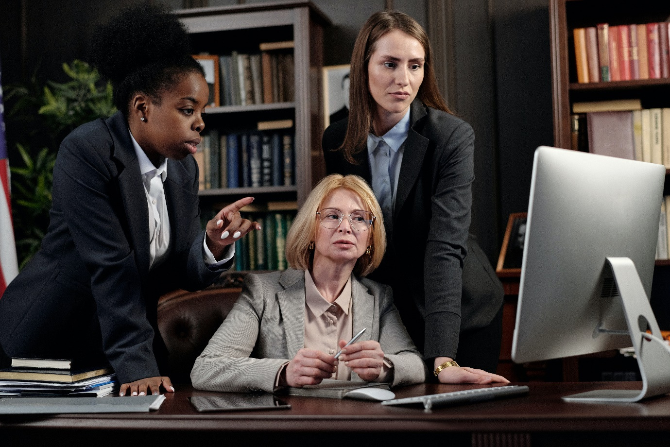 Immigration law attorneys looking at a computer screen