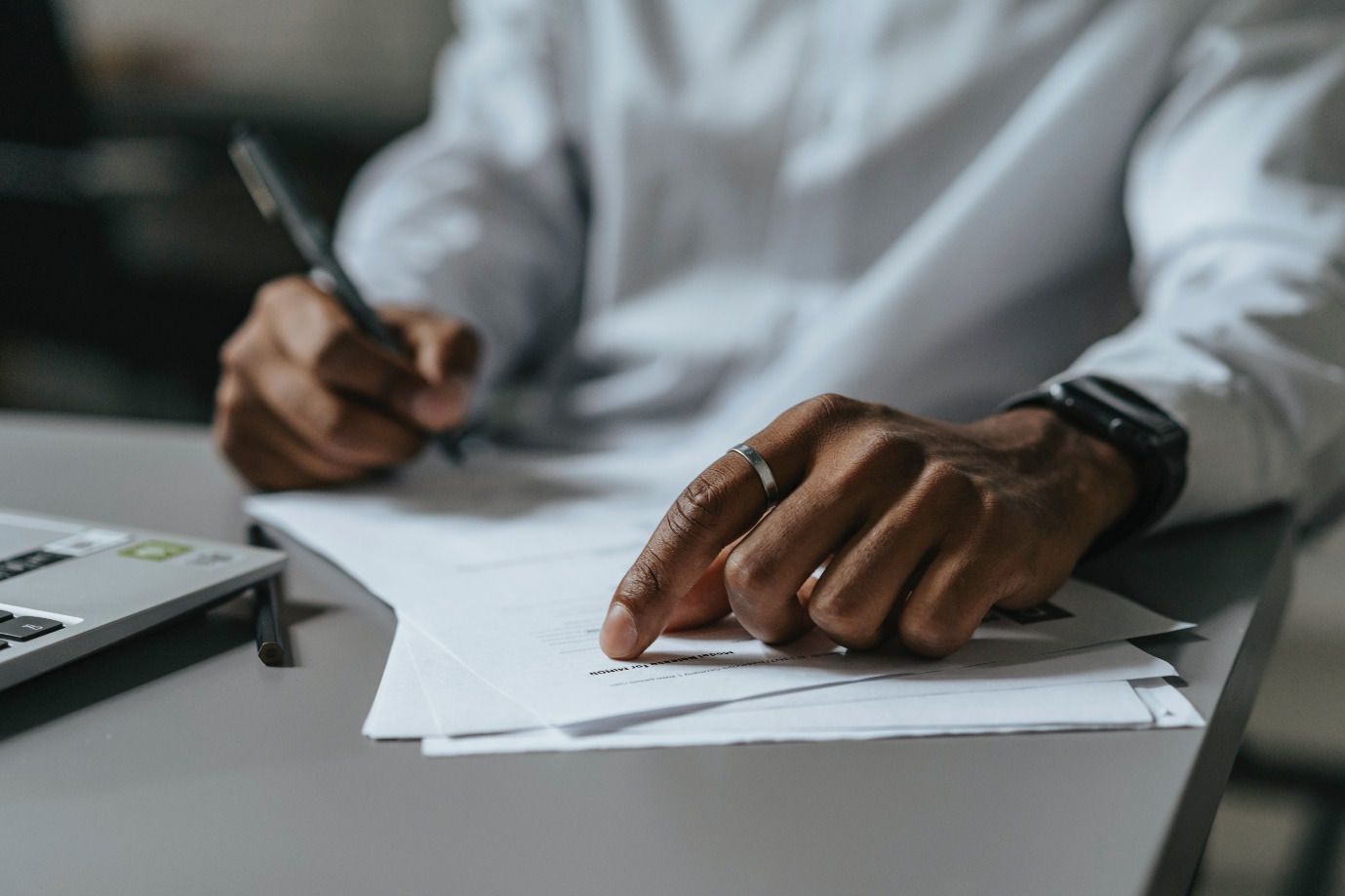 A person looking at documents on the table 