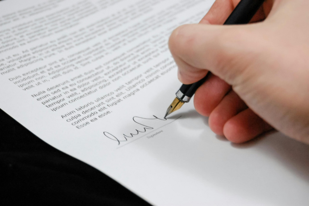 A person signing a contract