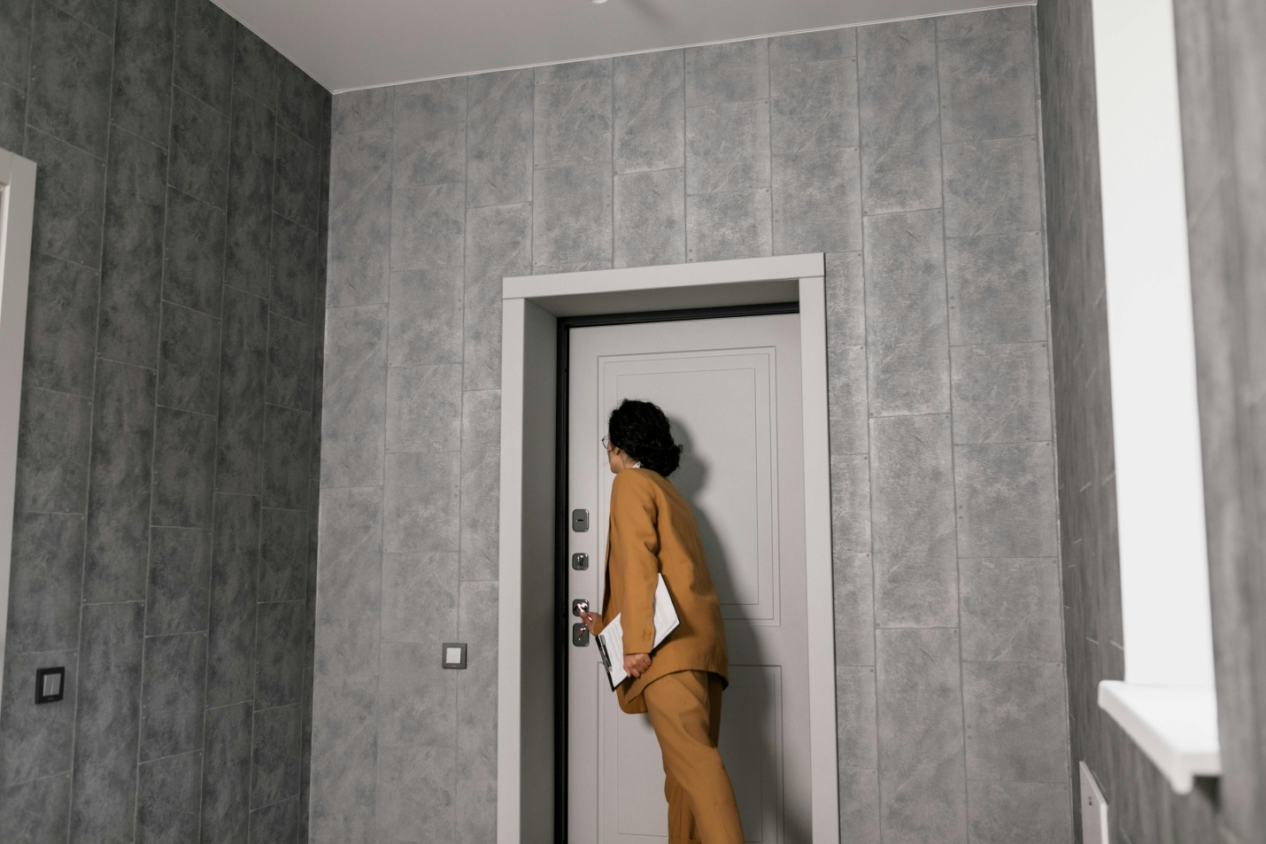 A woman opening a door