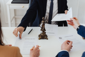 a couple reviewing divorce papers with a divorce attorney in Houston