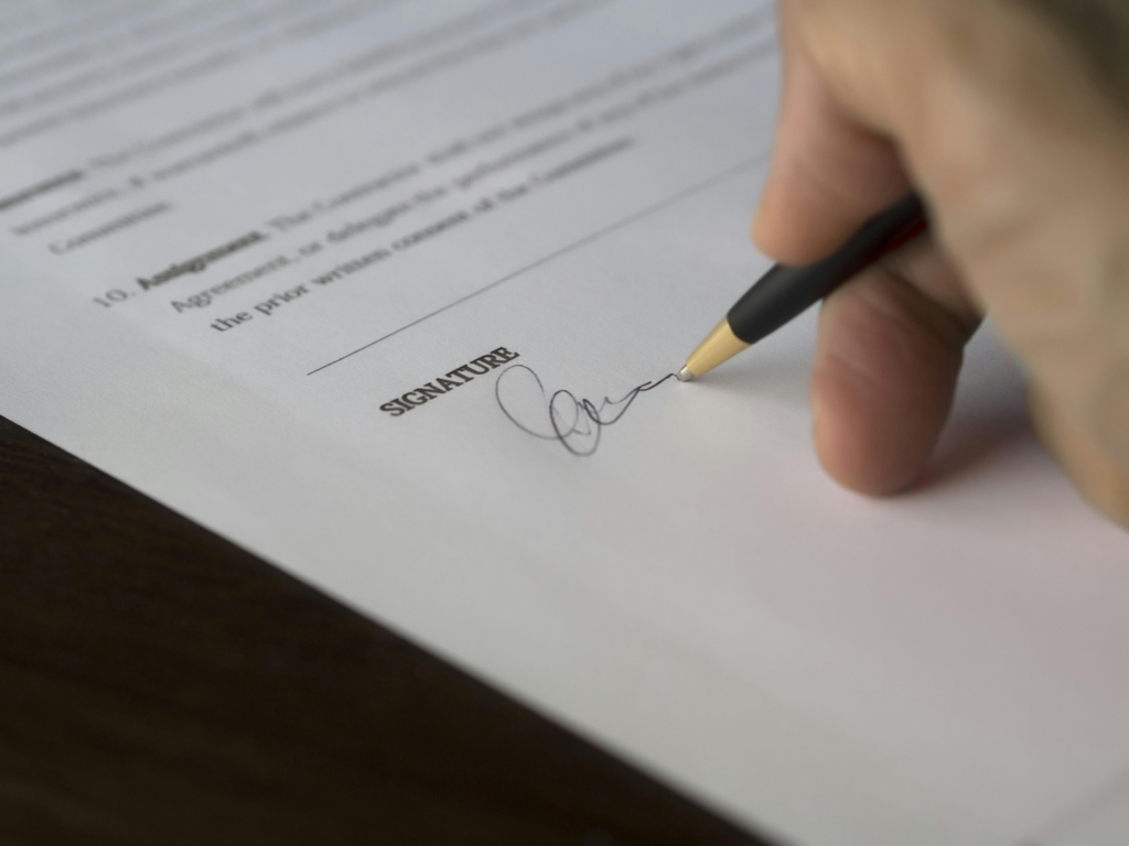 A person signing a document