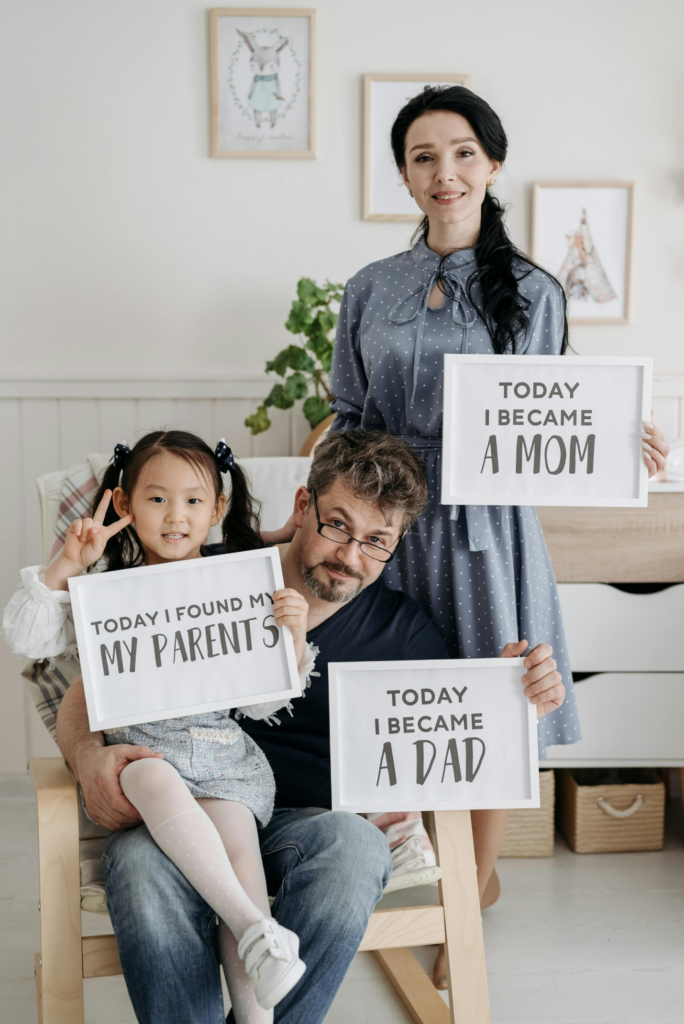 A family holding placards