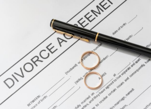  A divorce agreement with rings and a pen