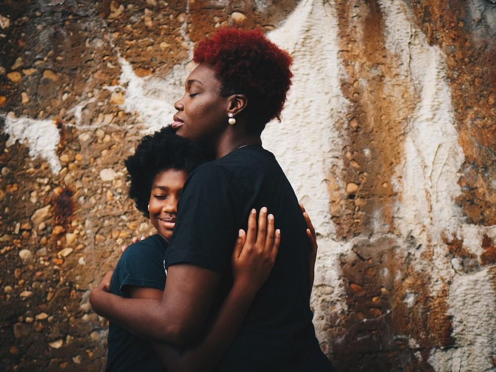 A woman hugging her daughter