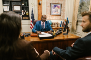 A lawyer consulting with a couple in his office