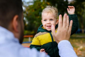 A man playing with his kid