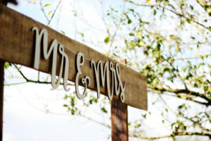 A wooden plaque with Mr. & Mrs. signage