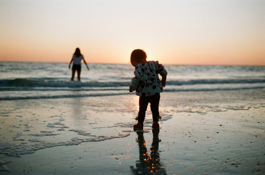 A mother and her child on the sea shore