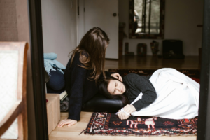 A woman consoling another woman