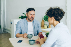 A couple discussing postnuptial agreements