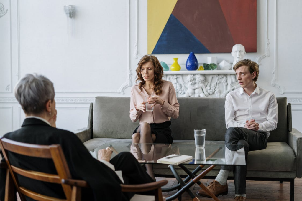 A couple discussing their estate plan with a lawyer.