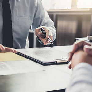 Two people reviewing a document