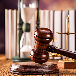 A wooden gavel on a table