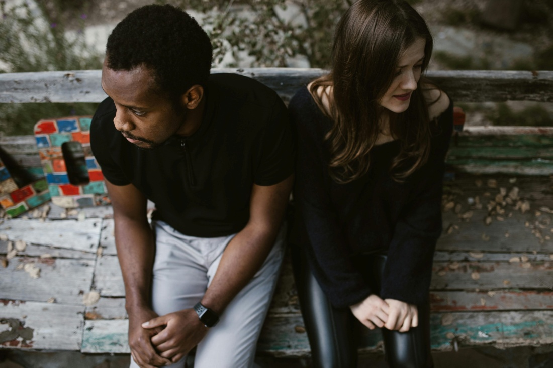 A couple sitting on a bench