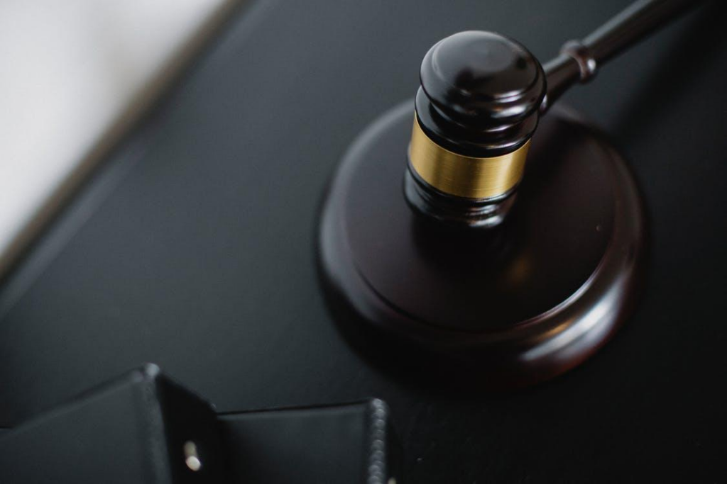 A gavel on a black table