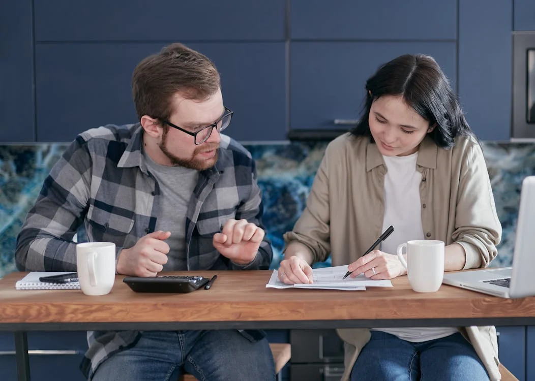 A couple reviewing a postnuptial agreement