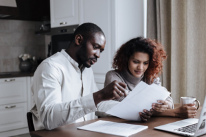 A couple reviewing a postnuptial agreement 