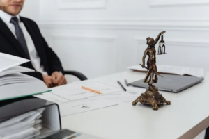 An adoption lawyer sitting on a chair