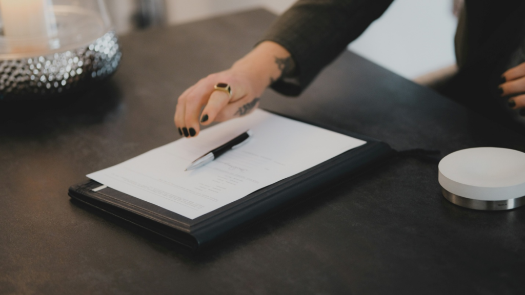 A woman about to sign a contract