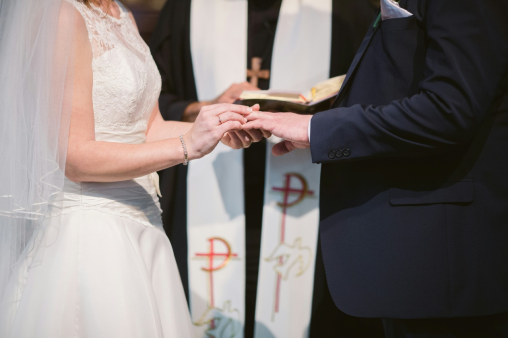 A couple exchanging rings at a wedding