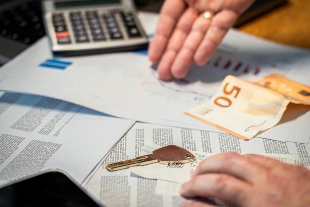 A key and a calculator on documents